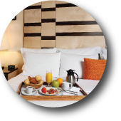 Image of Capital Bedding's Hospitality Line Logo. The logo contains a picture of a hotel room bed.